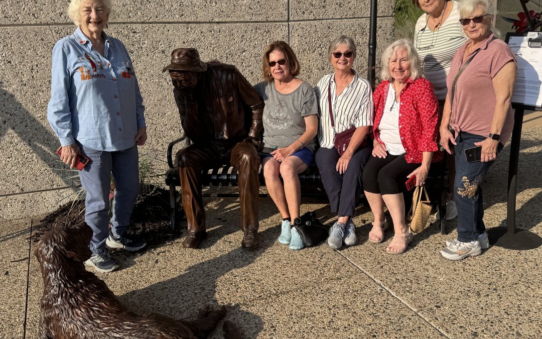 Port Clinton Artists' Club member enjoying Andy Sacksteder's Sculpture