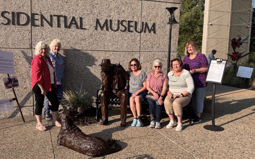 Port Clinton Artists' Club member enjoying Andy Sacksteder's Sculpture