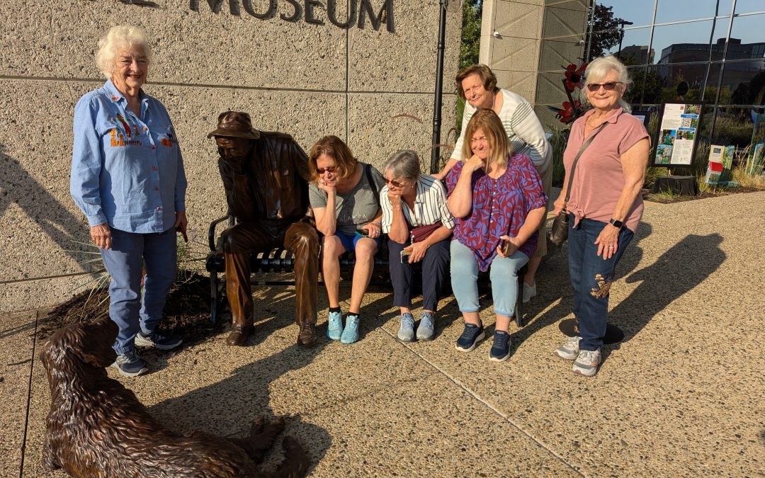 Port Clinton Artists' Club member enjoying Andy Sacksteder's Sculpture